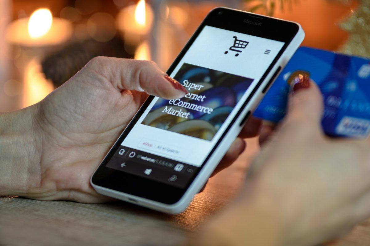 SEO Services in Whangarei, Auckland and throughout NZ Woman using smartphone to make a purchase online