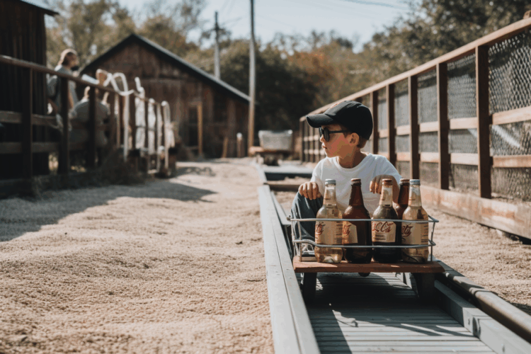 Boy coasting on tracks